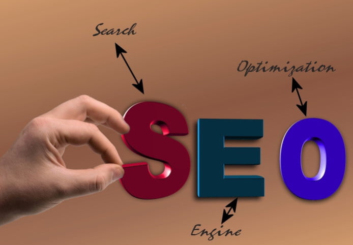 a hand holding letter s for seo legal firms