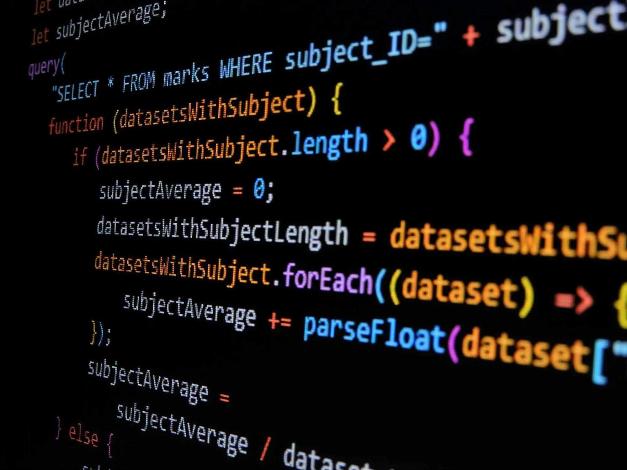 Enterprise SEO concept illustrated with colorful programming code on a dark screen.