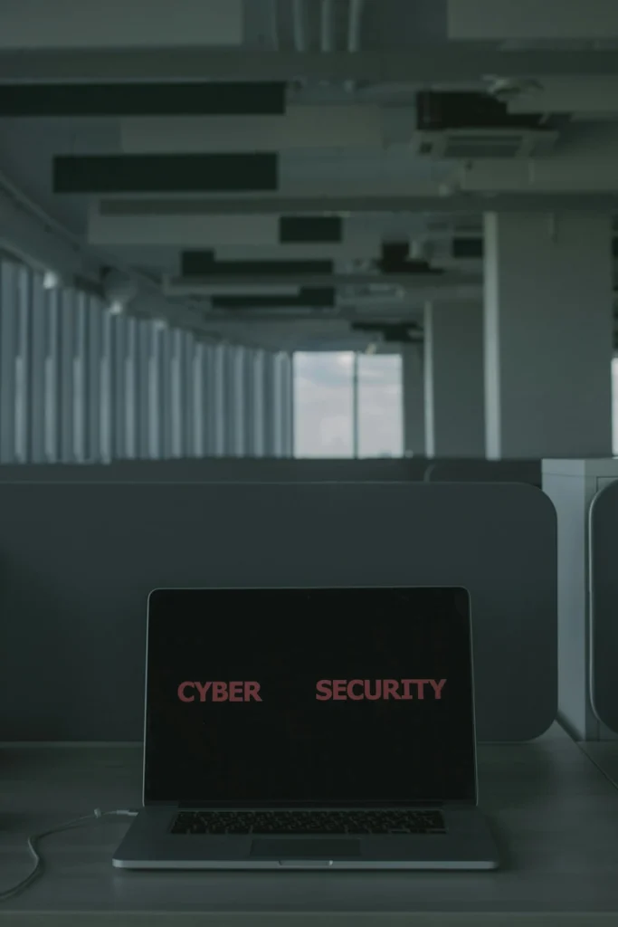 Laptop screen displaying “CYBER SECURITY” representing AI protection and data safety.
