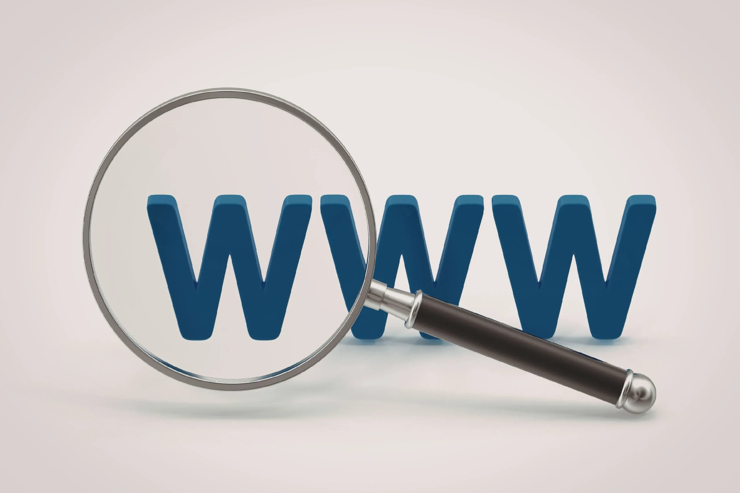 Choosing the right domain name for your website Magnifying glass over the letters WWW symbolizing domain name for SEO