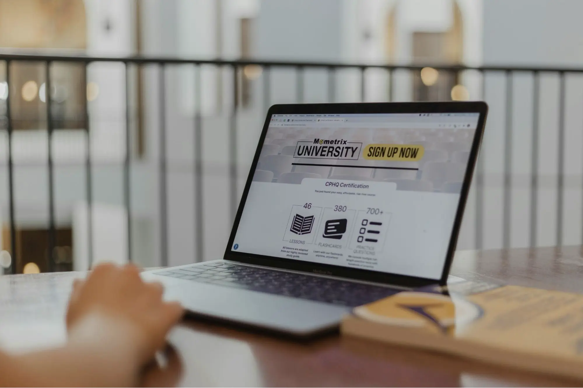 Educational website displayed on a laptop A person viewing a university webpage on a laptop illustrating strategies on how to rank using long-Tail keywords