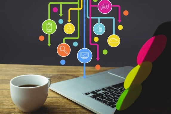 An illustration of various marketing icons like search and chat leading into a laptop, which SaaS SEO agencies use to build data-driven strategies.